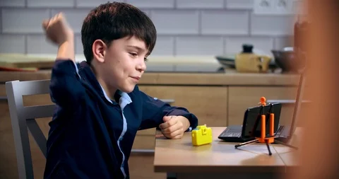 The blogger boy is telling something on the camera and gesturing very actively Stock Footage 127087180