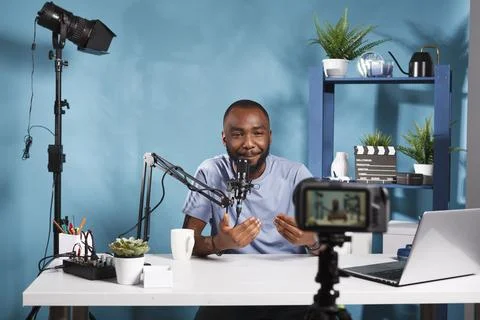 Blogger creating content with camera Stock Photos