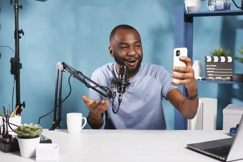 Blogger creating content with smartphone Stock Photos