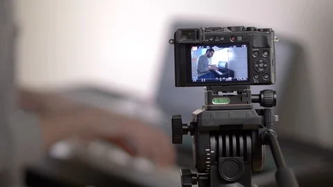 Blogger Filming His Piano Tutorial Closeup on Camera Stock Footage 106632400
