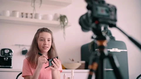 Blogger girl is recording tutorial video. 動画素材 196234234
