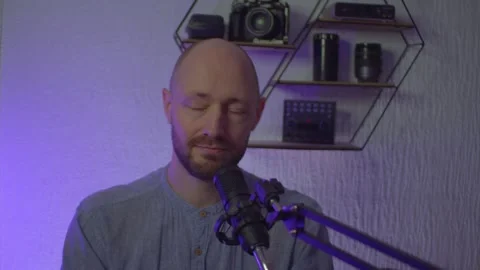 A blogger guy is recording in a studio Stock Footage 305238787