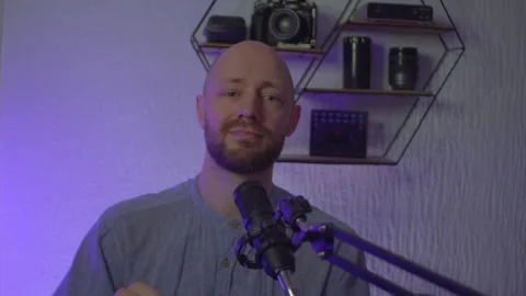 A blogger guy is recording in a studio Stock Footage 305238961