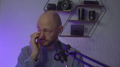 A blogger guy is recording in a studio Stock Footage 305239401