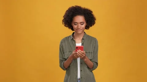 Blogger lady use device mind comment isolated mustard color background Stock Footage 166162326