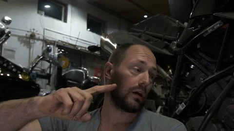 Blogger mechanic talks about the progress of motorcycle repair Stock Footage 162867148