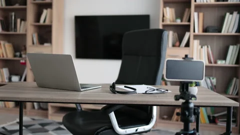 Blogger or content creator putting laptop computer, reports, papers on table Stock Footage 231223528