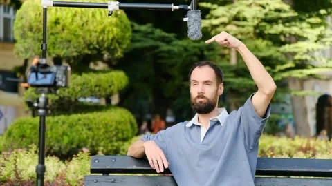 Blogger talks about technical parameters of microphone installation Stock Footage 279377684