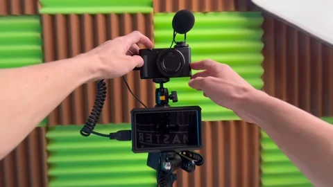 The blogger turns on the display on the camera and starts recording a blog video Stock Footage 239163512