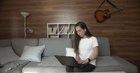 Blogger writes an article in a cozy atmosphere at home Video stock 133368290