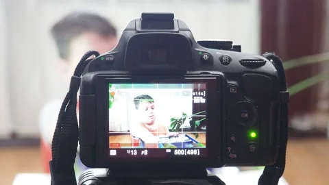 Blogging, technology and people concept boy or blogger camera recording video 库存影片 151035856