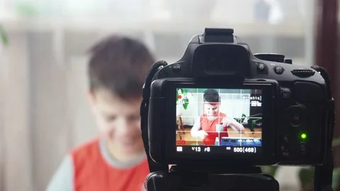 Blogging, technology and people concept boy or blogger camera recording video Stockbeeldmateriaal 151036138