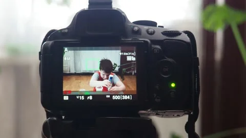 Blogging, technology  concept -  boy or blogger recording video at home 库存影片 151037558