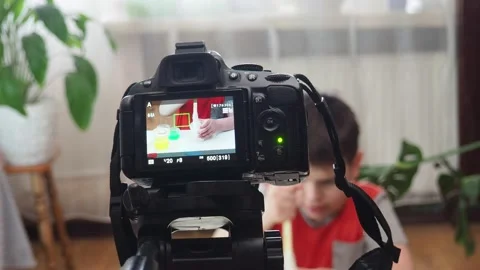 Blogging, technology  concept -  boy or blogger recording video at home 库存影片 151038023