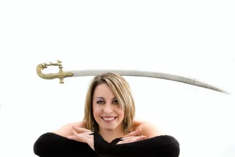 Blond balancing sword Stock Photos