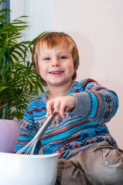 Blond boy baking Stock Photos