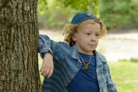 Blond boy with a blue cap Foto stock