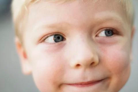 Blond child face in close-up Stock Photos