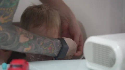 Blond child inhales vapors containing medications from inhaler. Stock Footage 331663190