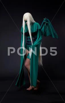 Blond girl in green fury cosplay character Stock Photos