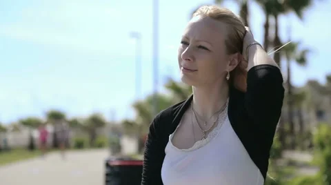 Blond lady waves her hand. 動画素材 49815680