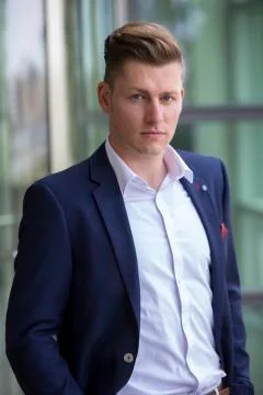 Blond man in suit looking at camera 写真素材