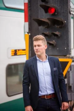 Blond man waiting for the train Stock Photos