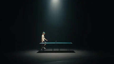 Blond Ping pong player in a dark room Stock Footage 279242471
