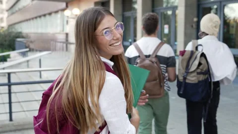 Blond student girl going to classes with group of college friends walking Stock Footage 260224991
