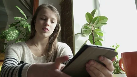 Blond teenager girl using tablet Stock Footage 73290527