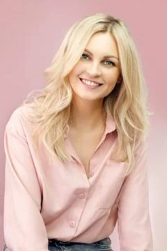 Blond woman in casual style. Blond woman in pink colors.Pastel colors and a girl Stock Photos