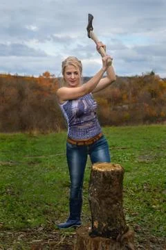 Blonde with axe Stock Photos