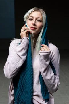 A blonde beautiful young model posing with a scarf in an university campus Stock Photos