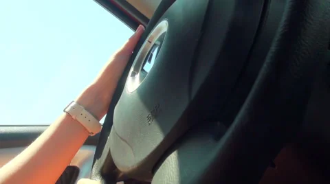 Blonde behind the wheel of the machine Stock Footage 32862238