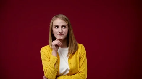 The blonde bit her lip and thought about something good Stock Footage 163880924