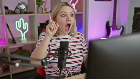 Blonde bombshell gaming streamer on a roll! young woman with skyrocketing s.. Stock Footage 264797367
