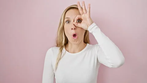 Blonde bombshell radiates shock and surprise! gutsy young woman makes a che.. Stock Footage 273740835