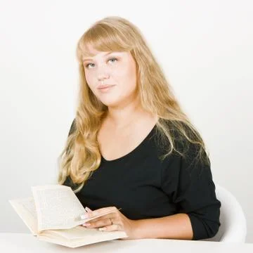 Blonde with a book Stock Photos