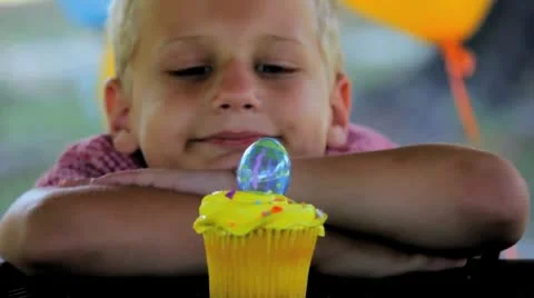 Blonde Boy with Easter Egg Cupcake Stock Footage 8986085