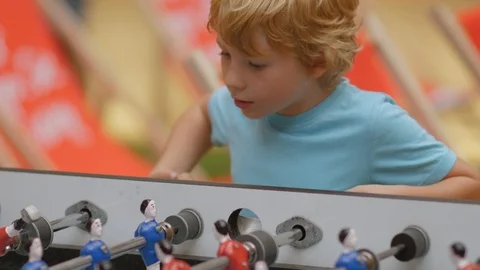 Blonde Boy Playing With Passion Table Football (Table Soccer Foosball Kicker) 스톡 동영상 92965269