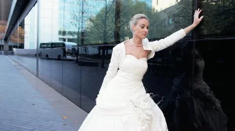 Blonde bride posing against mirror windows Stock-Footage 20470747