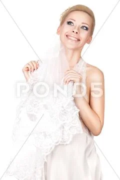 Blonde bride with a veil. Stock Photos