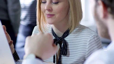 Blonde Businesswoman Talking to Coworker Stock Footage