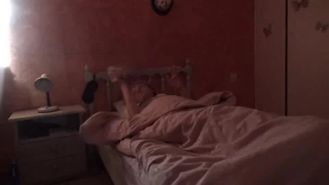 A blonde checks her email on her phone Video stock 309317833
