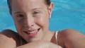 Blonde child girl in swimming pool HD Footage