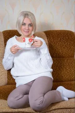 Blonde with a cup Stock Photos