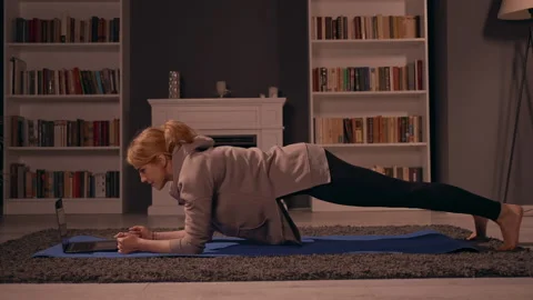 Blonde doing workout with coach remote Stock Footage 150202782