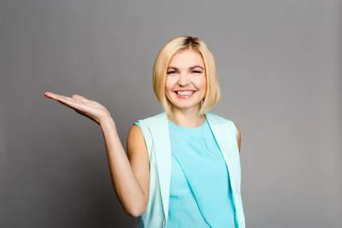 Blonde on empty gray background Stock Photos