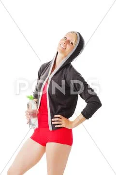 Blonde female in sports wear holding a bottle of water Stock Photos
