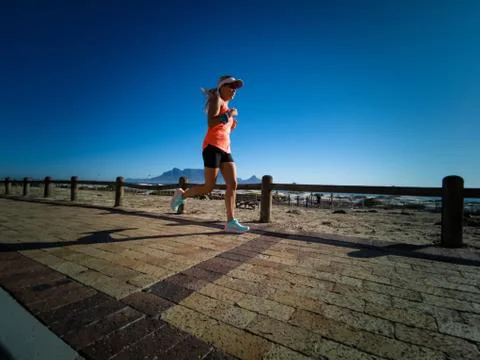 Blonde girl active &amp; running Stock Photos